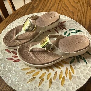 Crocs platform sandals.  Cream colour with gold accents.